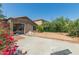 Backyard featuring a patio, desert landscaping, and exterior home views at 10009 W Raymond St, Tolleson, AZ 85353