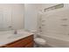 Bright bathroom with a tub-shower combination and vanity with sink at 10009 W Raymond St, Tolleson, AZ 85353