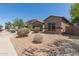 Charming one-story home featuring desert landscaping and a well-maintained front yard at 10009 W Raymond St, Tolleson, AZ 85353