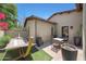 Backyard featuring lush plants, pavers, seating, hammock and beautiful blooms at 10152 E Phantom Way, Scottsdale, AZ 85255