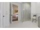 Luxurious bathroom with a glass-enclosed shower and access to the main bedroom at 10152 E Phantom Way, Scottsdale, AZ 85255