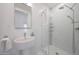 Modern bathroom featuring a glass enclosed shower and pedestal sink at 10152 E Phantom Way, Scottsdale, AZ 85255