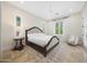 Comfortable bedroom featuring beautiful hardwood floors and large windows showcasing outdoor scenery at 10152 E Phantom Way, Scottsdale, AZ 85255