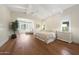 Inviting bedroom featuring a beamed ceiling, hardwood floors, and plenty of natural light at 10152 E Phantom Way, Scottsdale, AZ 85255