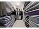 A large walk-in closet with metal racks and shelves for optimal storage solutions at 10152 E Phantom Way, Scottsdale, AZ 85255