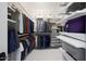 Walk-in closet providing ample storage with a variety of shelving and hanging options at 10152 E Phantom Way, Scottsdale, AZ 85255