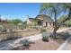 Charming single-story home featuring a red tile roof, desert landscaping, and a welcoming facade at 10152 E Phantom Way, Scottsdale, AZ 85255