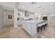 Spacious kitchen with large island, stone countertops, and stainless steel appliances at 10152 E Phantom Way, Scottsdale, AZ 85255