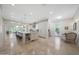 Open kitchen with large island, stone countertops, and stainless steel appliances at 10152 E Phantom Way, Scottsdale, AZ 85255