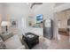Cozy living area featuring modern furnishings, a kitchenette, and access to an attached bedroom at 10152 E Phantom Way, Scottsdale, AZ 85255