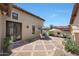 A beautiful patio with a fireplace and comfortable seating, ideal for outdoor relaxation at 10152 E Phantom Way, Scottsdale, AZ 85255