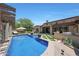 Backyard retreat features a sparkling blue pool and patio area perfect for relaxation and entertaining at 10152 E Phantom Way, Scottsdale, AZ 85255