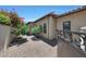 Charming side yard features desert landscaping, flowering trees, and neutral stucco wall at 10152 E Phantom Way, Scottsdale, AZ 85255