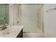 Bathroom vanity and shower with sliding glass door featuring modern fixtures and natural light at 10370 W Sands Dr # 463, Peoria, AZ 85383
