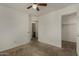 Bedroom with neutral carpet, ceiling fan, and doorways to other rooms at 10370 W Sands Dr # 463, Peoria, AZ 85383