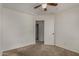 This carpeted bedroom features a ceiling fan and view into the en suite bathroom at 10370 W Sands Dr # 463, Peoria, AZ 85383