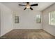 Well-lit bedroom with neutral walls and carpet; the ceiling fan provides added comfort at 10370 W Sands Dr # 463, Peoria, AZ 85383