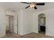 Spacious bedroom featuring a ceiling fan, neutral carpeting, and an ensuite bathroom at 10370 W Sands Dr # 463, Peoria, AZ 85383