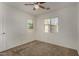 This carpeted bedroom features two windows to bring in the natural sunlight at 10370 W Sands Dr # 463, Peoria, AZ 85383