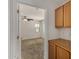 Bright bedroom showcasing neutral carpet, ceiling fan, and wood cabinets at 10370 W Sands Dr # 463, Peoria, AZ 85383