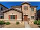 Inviting two-story home with a well-maintained front yard and charming desert landscaping at 10370 W Sands Dr # 463, Peoria, AZ 85383