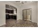 Open kitchen with dark cabinets, stainless steel appliances, and sliding glass door at 10370 W Sands Dr # 463, Peoria, AZ 85383