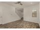 Inviting living room featuring wood-look floors, a ceiling fan, and natural light at 10370 W Sands Dr # 463, Peoria, AZ 85383
