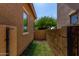 Side yard showcasing turf and exterior home siding at 10370 W Sands Dr # 463, Peoria, AZ 85383