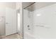 A clean bathroom featuring a shower-over-tub with white tile surround and a shower head at 10735 E Kilarea Ave, Mesa, AZ 85209