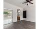 Modern bedroom featuring light grey walls, modern ceiling fan, sliding door closet, and attached bathroom at 10735 E Kilarea Ave, Mesa, AZ 85209