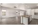 Modern kitchen featuring a large island with a sink, stainless steel appliances, and wood-look flooring at 10735 E Kilarea Ave, Mesa, AZ 85209