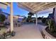 An entertainer's backyard with a covered patio, outdoor furniture, pool, and mature landscaping at 1085 E Oakland Ct, Gilbert, AZ 85295