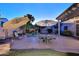 Backyard with patio furniture, outdoor lighting, mature landscaping, and a water feature at 1085 E Oakland Ct, Gilbert, AZ 85295