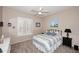 Inviting bedroom with a metal-frame bed, neutral decor, and natural light filtering through window shutters at 1085 E Oakland Ct, Gilbert, AZ 85295