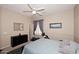 Cozy bedroom showcasing plush carpeting, soft lighting, and functional exercise equipment at 1085 E Oakland Ct, Gilbert, AZ 85295
