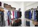 Well-organized walk-in closet with ample hanging space and shelving at 1085 E Oakland Ct, Gilbert, AZ 85295