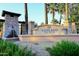 Welcoming entrance to Ashland Ranch with stone signage, water feature, and manicured landscaping at 1085 E Oakland Ct, Gilbert, AZ 85295