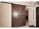 Home foyer with a large wooden sliding door and tile flooring at 1085 E Oakland Ct, Gilbert, AZ 85295