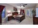 Spacious main bedroom with carpet, access to backyard, stylish furniture, and ample natural light at 1085 E Oakland Ct, Gilbert, AZ 85295