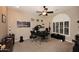 Bright office space featuring contemporary decor, neutral walls, and a ceiling fan above dual workstations at 1085 E Oakland Ct, Gilbert, AZ 85295