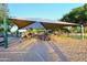 Community playground featuring various play structures, swings, and shaded area for enjoyment at 1085 E Oakland Ct, Gilbert, AZ 85295