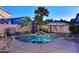 Backyard oasis featuring a sparkling pool, tropical plants, and inviting patio area at 1085 E Oakland Ct, Gilbert, AZ 85295