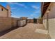 View of the backyard with a block fence, storage, and a gravel ground cover at 1245 W Cindy St, Chandler, AZ 85224