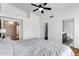 Bright bedroom features a ceiling fan, wood floor, and neutral walls for a comfortable and relaxing space at 1245 W Cindy St, Chandler, AZ 85224