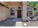 Welcoming front porch featuring a decorative front door, arched windows, and stone accents at 1245 W Cindy St, Chandler, AZ 85224