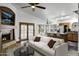 Open concept living space with a fireplace, kitchen island, and comfortable seating at 1245 W Cindy St, Chandler, AZ 85224