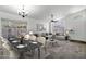 Open-concept living area featuring a dining table, comfortable seating, and lots of natural light at 1245 W Cindy St, Chandler, AZ 85224