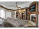 Cozy living room with a fireplace, built-in shelving, and neutral decor at 1245 W Cindy St, Chandler, AZ 85224