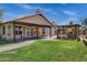 Charming covered patio with brick pavers, outdoor kitchen, and landscaped lawn, perfect for outdoor gatherings at 1245 W Cindy St, Chandler, AZ 85224