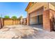 Spacious garage with brick accents and ample storage space, perfect for car enthusiasts or hobbyists at 125 E Loma Ln, Phoenix, AZ 85020